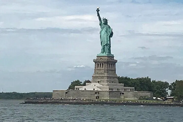 NYC Bus & Boat Adventure: Liberty, Landmarks & Local Lore!