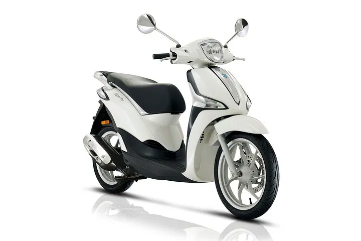 Parisian Freedom: Explore with a Piaggio 50cc Scooter Rental